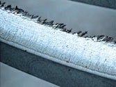 Plasma flame cut with burr formation and strong edge hardening.