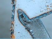 Laser flame cut with typical burr and corrosion formation.