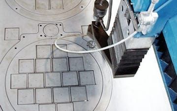 Abrasive waterjet cutting viewed from above.